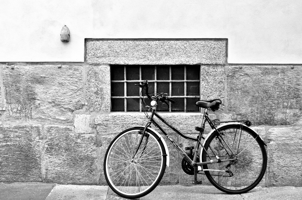 Bicycle leaning against a wall