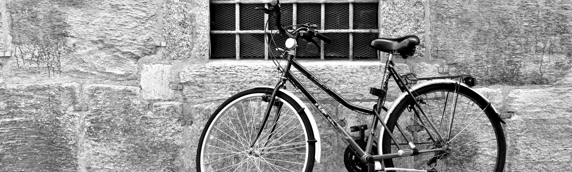 Bicycle leaning against a wall